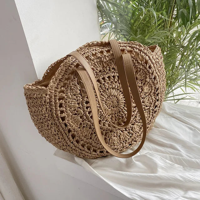 Arnora | Round braided handbag with imitation leather straps