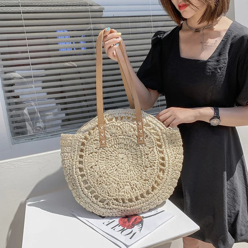 Arnora | Round braided handbag with imitation leather straps