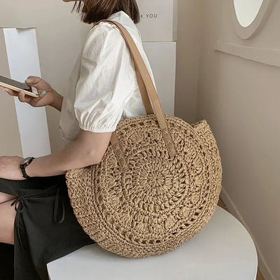 Arnora | Round braided handbag with imitation leather straps