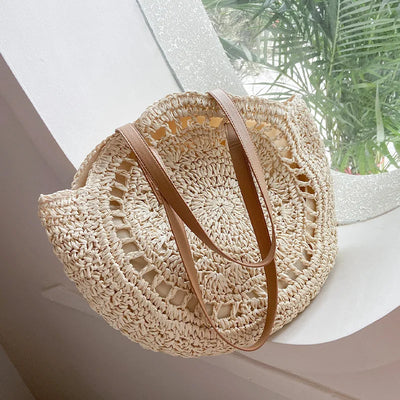Arnora | Round braided handbag with imitation leather straps
